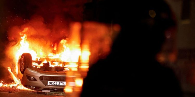 Masked rioters in Northern Ireland attack police, torch houses for second night