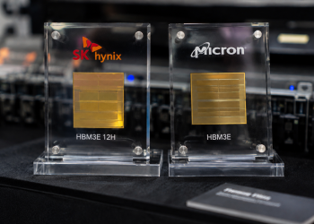 SK Hynix and Micron HBM3E memory chips displayed side by side at a technology showcase.