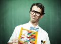 man in bowtie poses with abacus