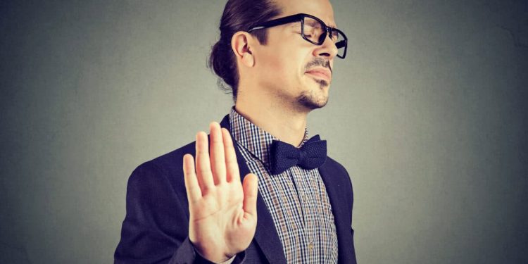 man gives stopping gesture