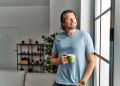 Middle aged man drinks coffee