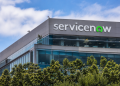 ServiceNow logo displayed on the exterior of a modern office building.