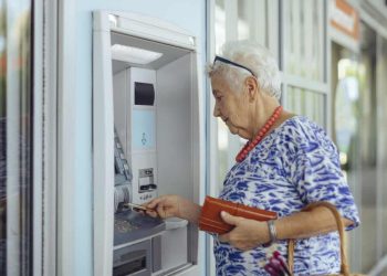 customer uses bank ATM