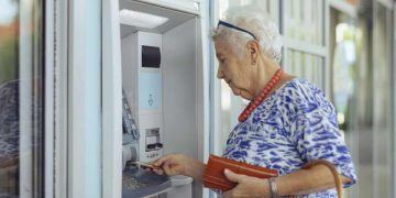 customer uses bank ATM