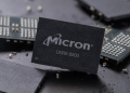 Micron DDR5 8200 memory chip displayed among semiconductor components.