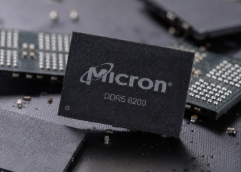 Micron DDR5 8200 memory chip displayed among semiconductor components.