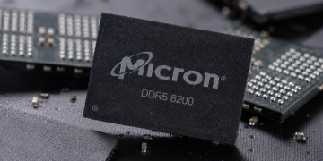 Micron DDR5 8200 memory chip displayed among semiconductor components.