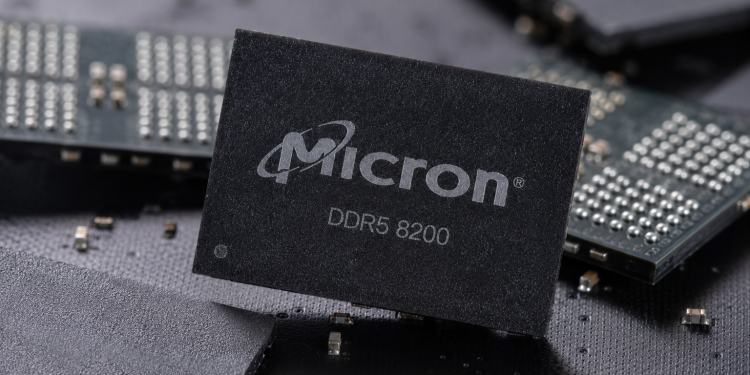 Micron DDR5 8200 memory chip displayed among semiconductor components.