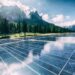 A solar cell panel generates power in a country mountain landscape.
