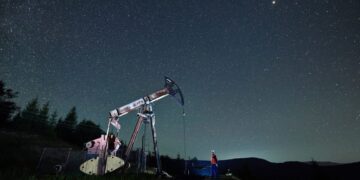 oil pump jack under night sky