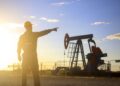 Oil industry worker works in oilfield