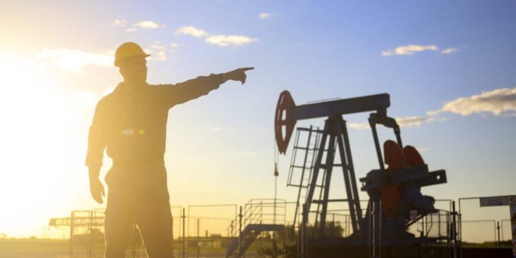 Oil industry worker works in oilfield