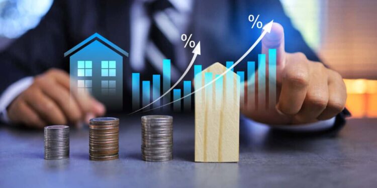 Real estate investment concept with person pointing on growth graph and coin stacking to get profit from property