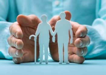 Hand Protecting Senior Couple