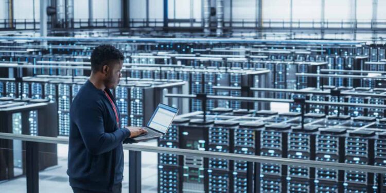 Data Center Engineer Using Laptop Computer crypto mining