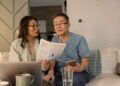 senior couple looks at investing statements