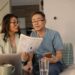 senior couple looks at investing statements