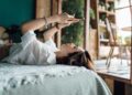 woman relaxes with phone
