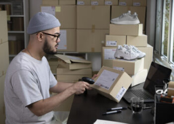scanning a package shipping label for ecommerce delivery