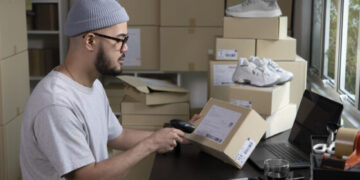 scanning a package shipping label for ecommerce delivery
