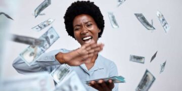 happy woman throws cash